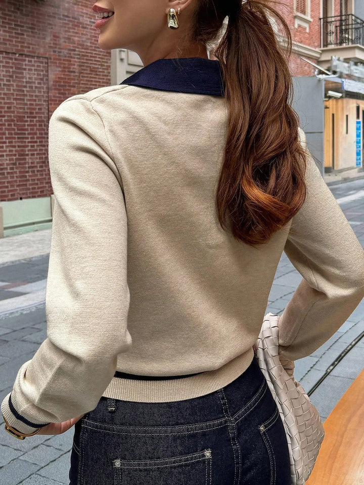 Back view of khaki polo sweater with contrast navy collar