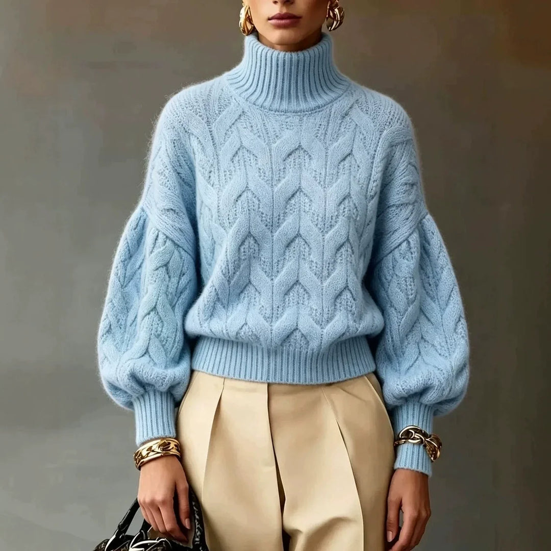 Light blue cable knit turtleneck sweater with ribbed hem