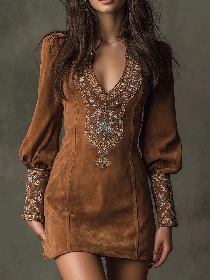 Close-up front view of brown embroidered mini dress bodice