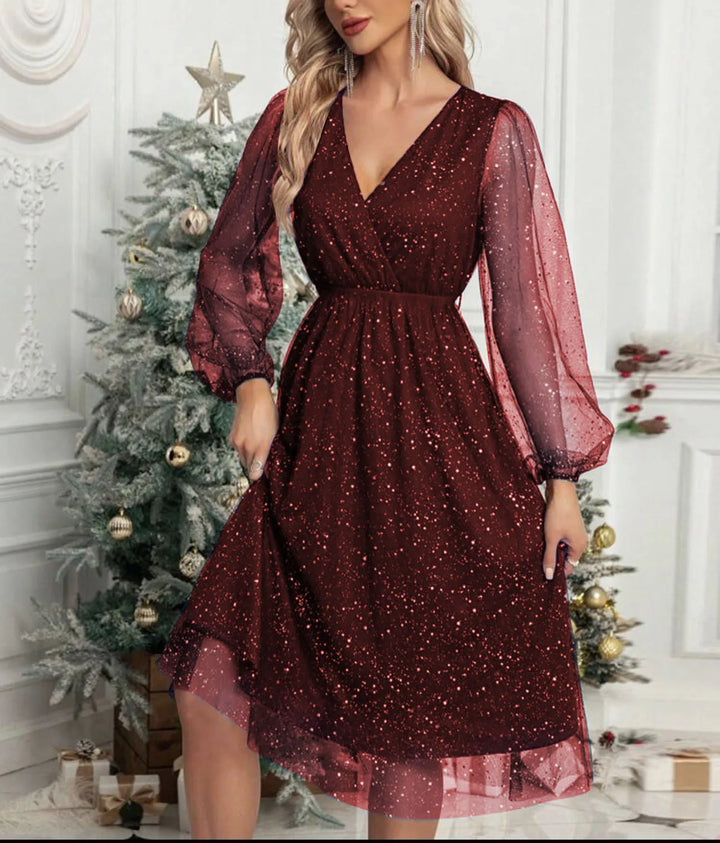 Woman wearing claret glitter mesh wrap dress with balloon sleeves