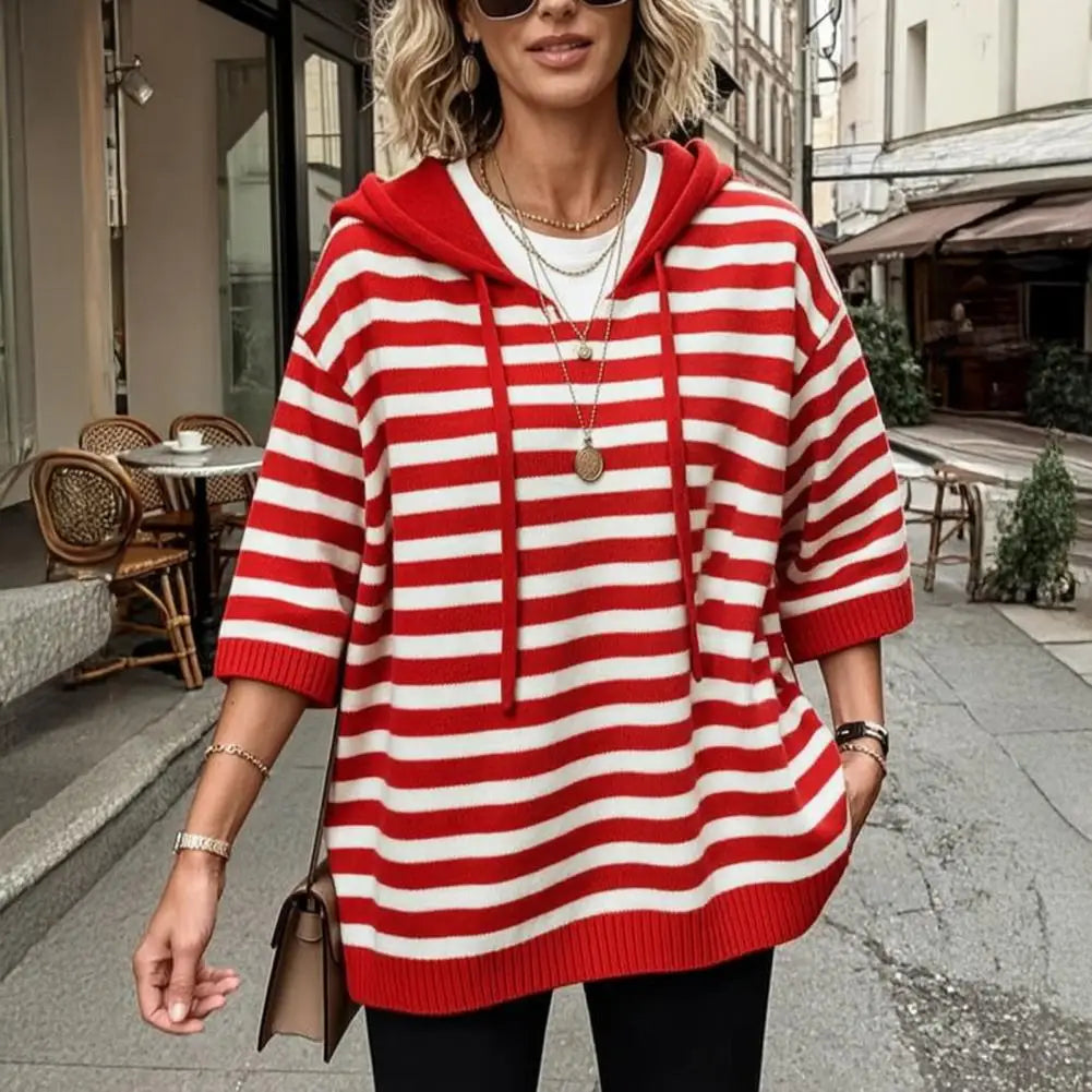 Red and white striped hooded sweater worn outdoors