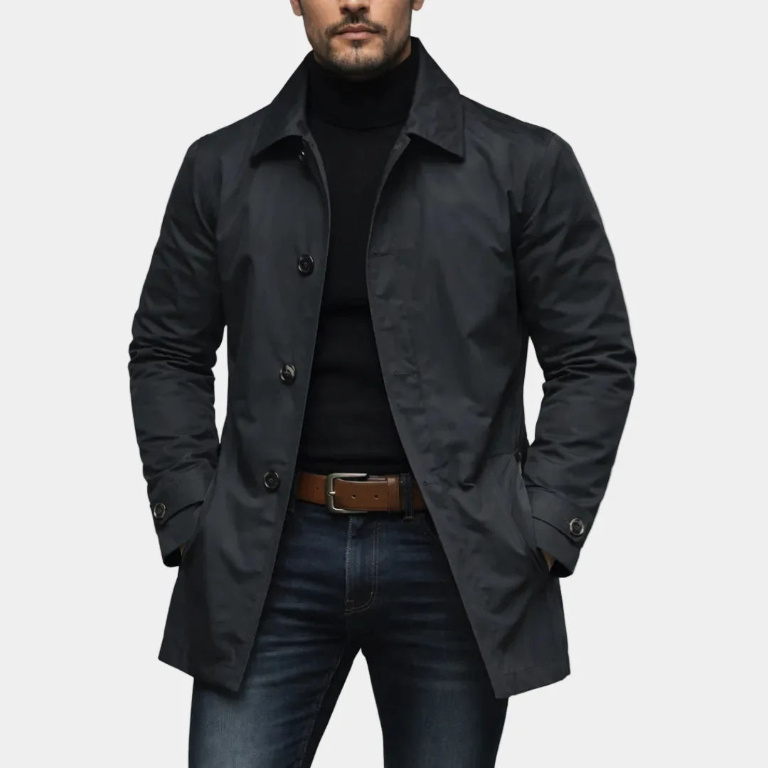 Black trench coat front view with side welt pockets
