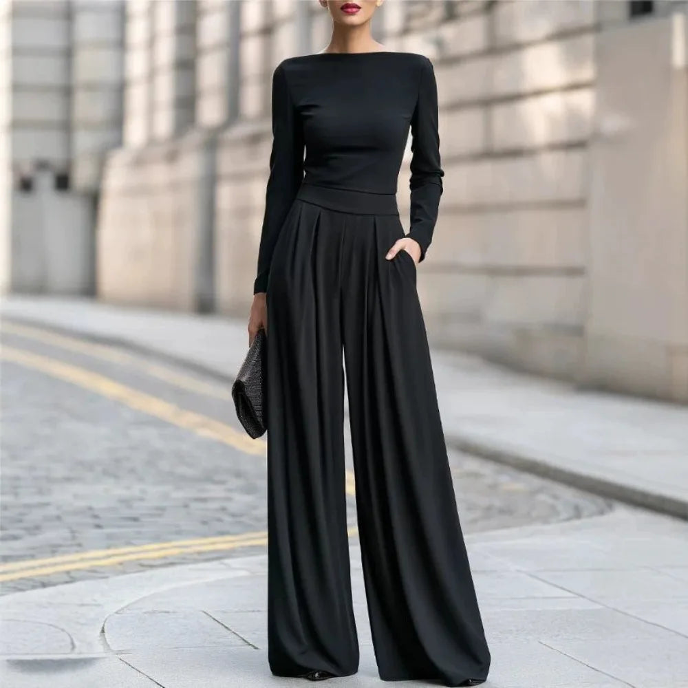 Black wide leg jumpsuit with long sleeves, full length front view