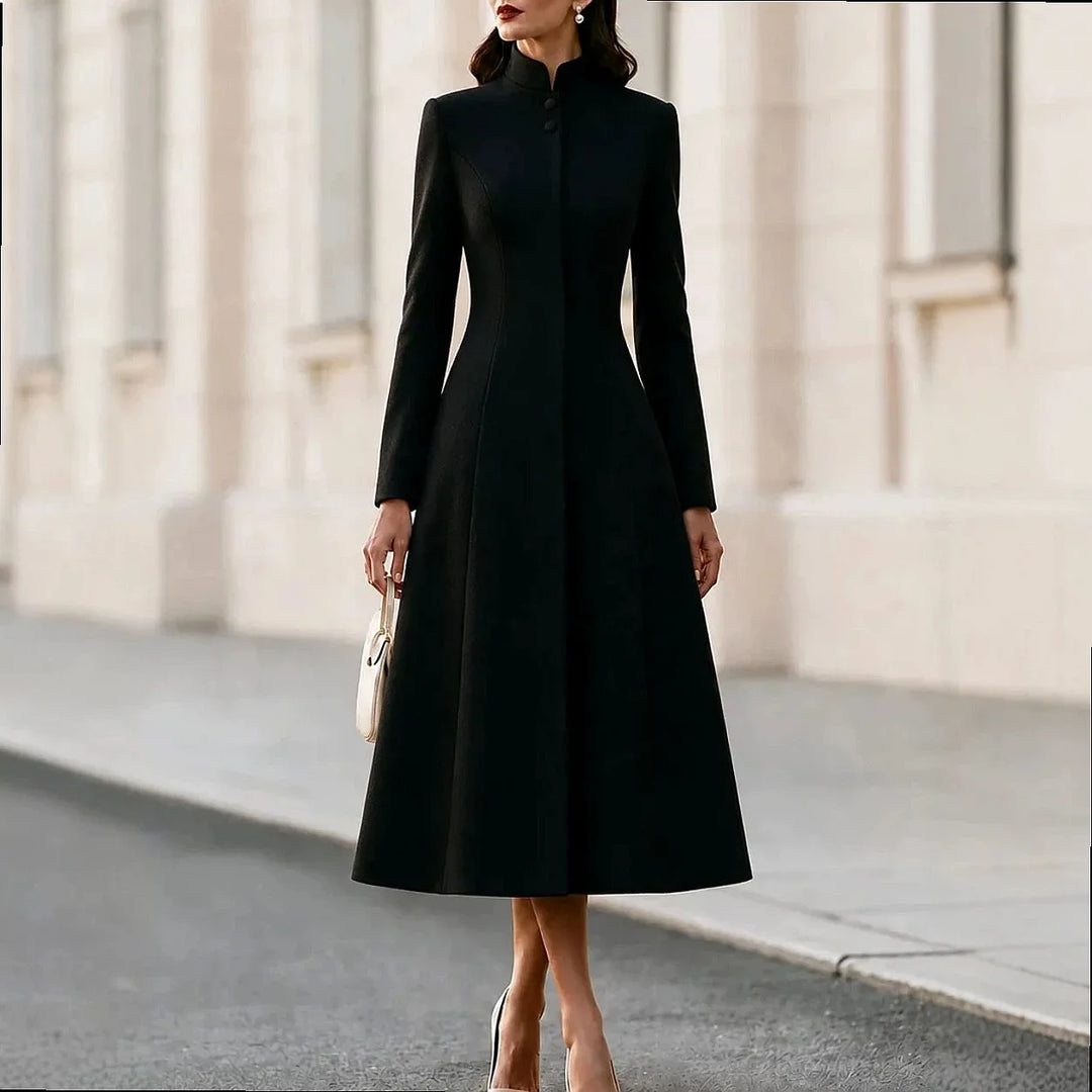 Woman wearing black stand collar coat dress with button front