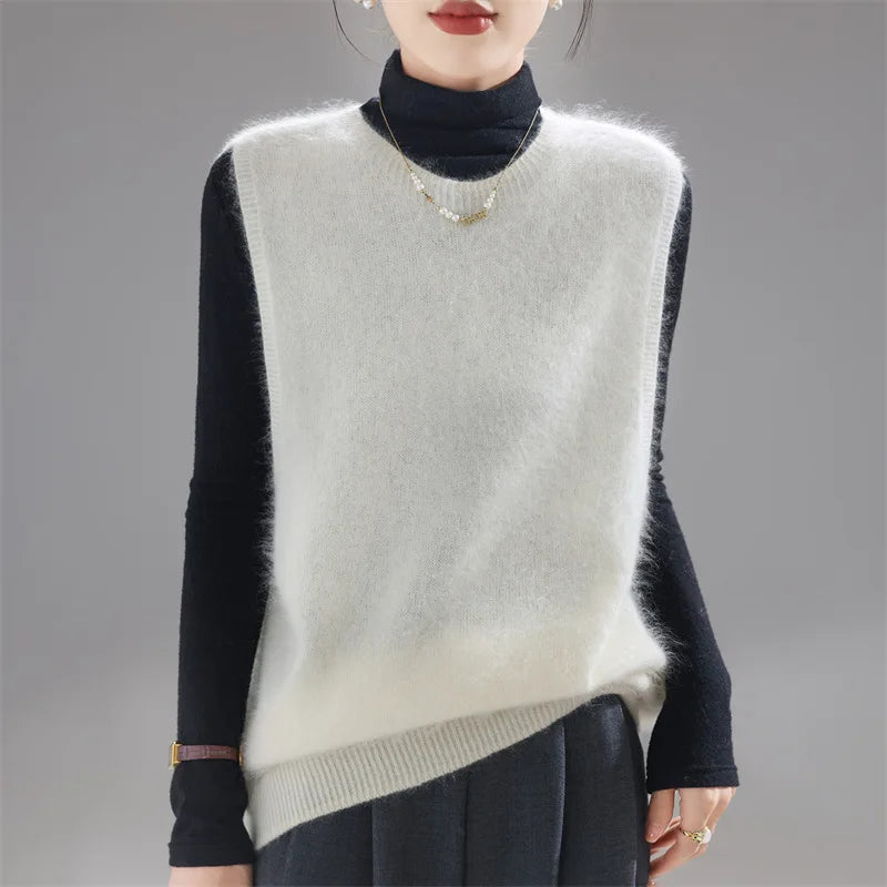 Ivory brushed knit sweater vest worn over black turtleneck