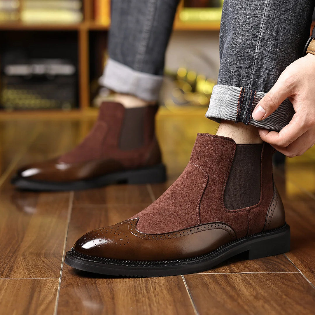 Man wearing brown Chelsea boots with cuffed jeans