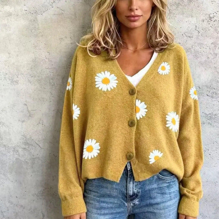 Woman wearing ginger yellow daisy embroidered cardigan