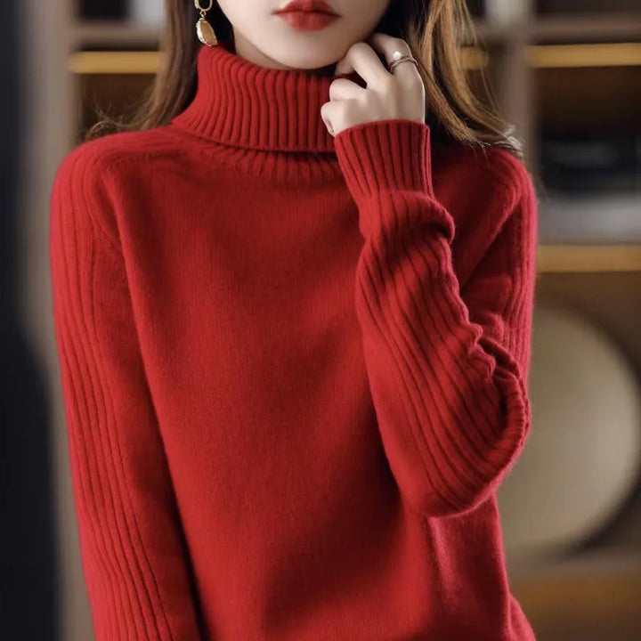 Red ribbed turtleneck knit sweater, close-up front view
