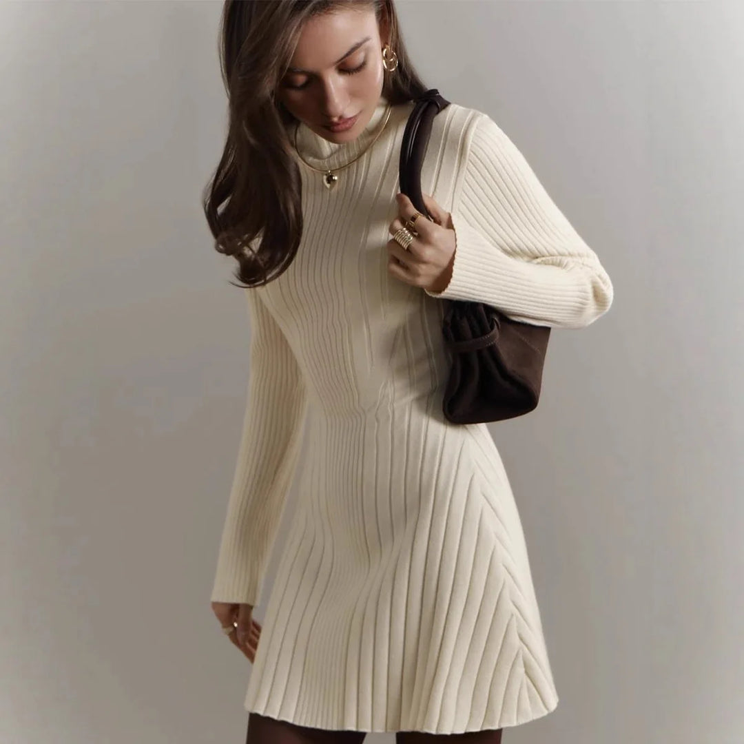 Woman in apricot ribbed knit A-line sweater dress with mock neck