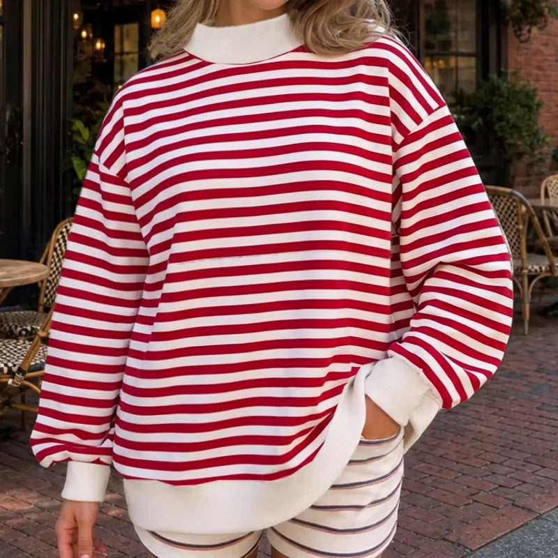 Woman wearing red and white striped oversized sweatshirt set