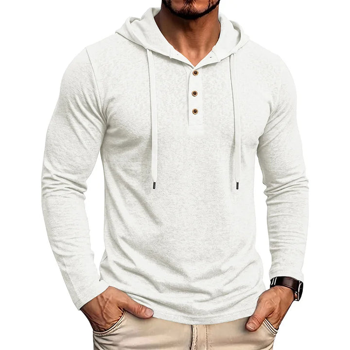 Man wearing white drawstring hooded pullover with half-button placket, front view