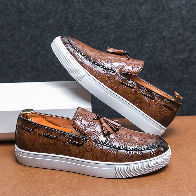 Brown diamond-embossed leather loafers with tassel detail, side pair view