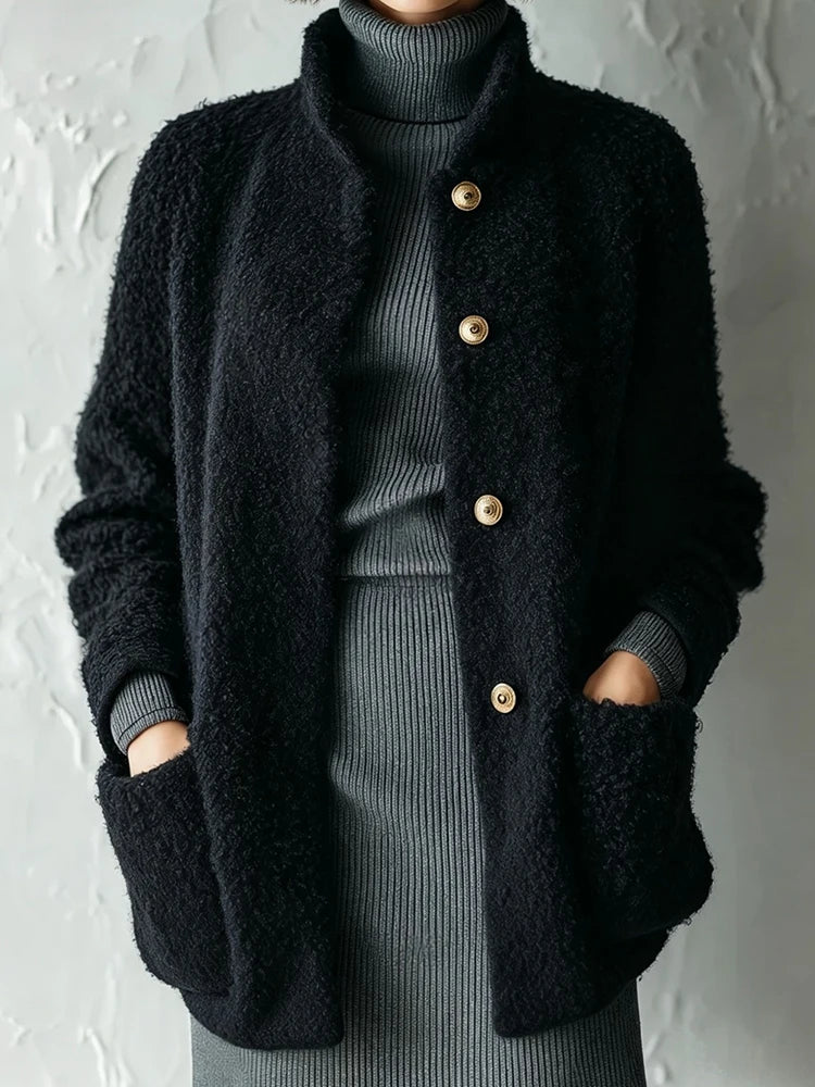 Black bouclé jacket with patch pockets, front view