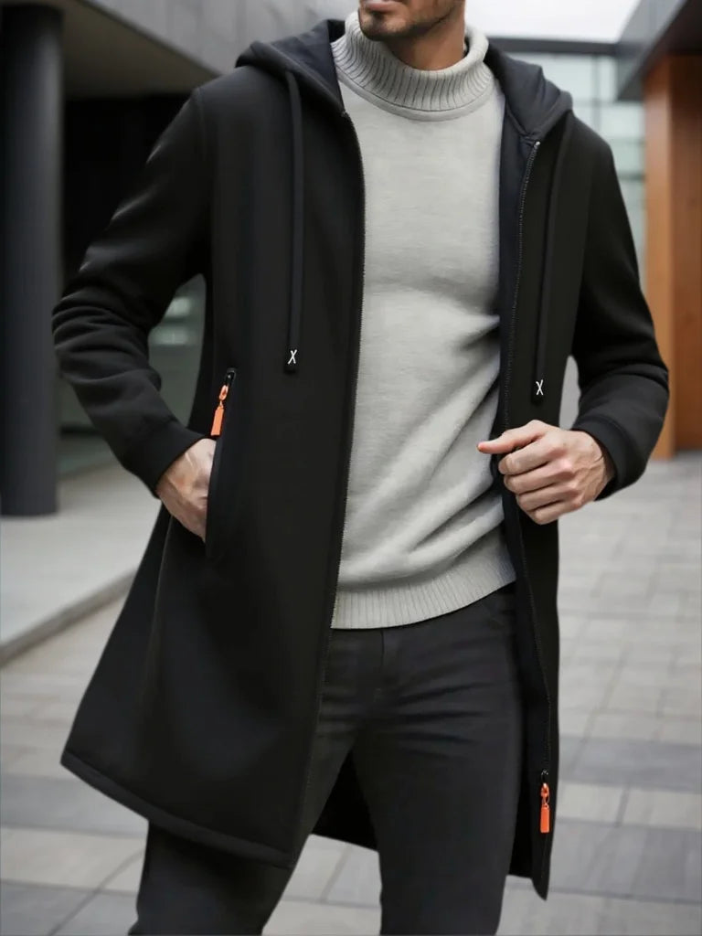Man wearing black hooded mid-length fleece jacket with drawstring hood