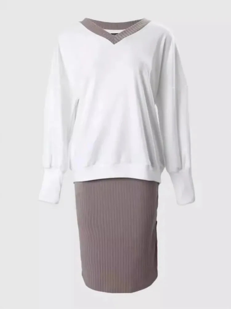 White sweatshirt and taupe ribbed skirt set on display