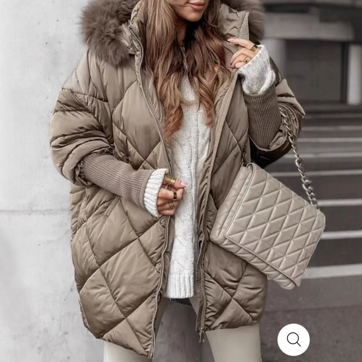 Woman wearing taupe diamond quilted puffer coat with faux fur hood