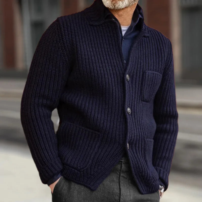 Navy ribbed knit cardigan worn outdoors with hands in pockets