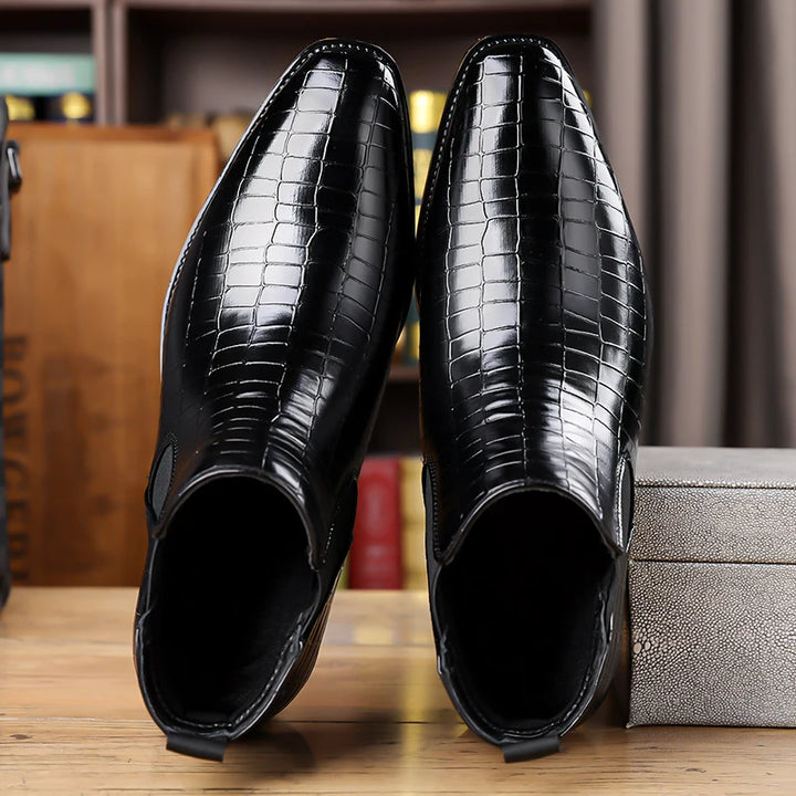 Top view of black croc-embossed Chelsea boots