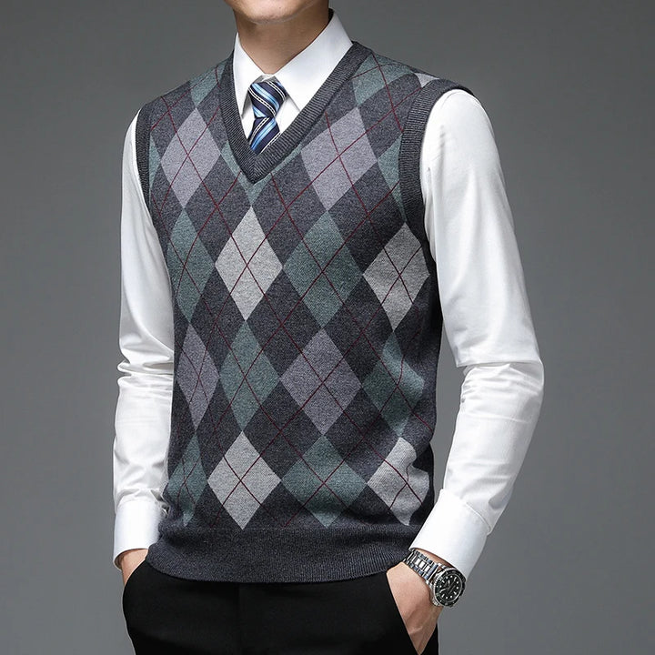 Man wearing dark gray argyle sweater vest with tie