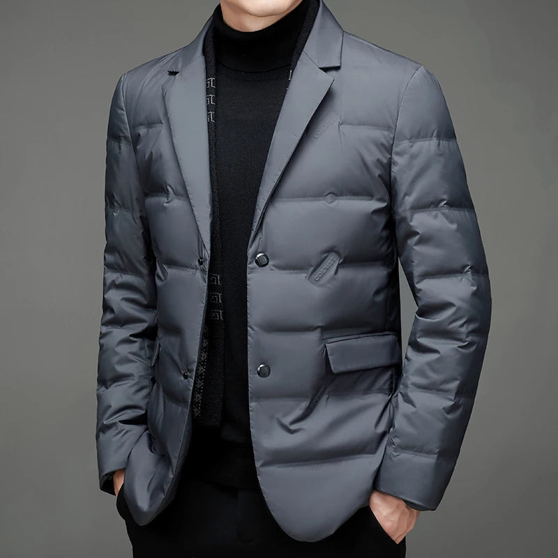 Man wearing grey quilted down blazer jacket with notched lapel