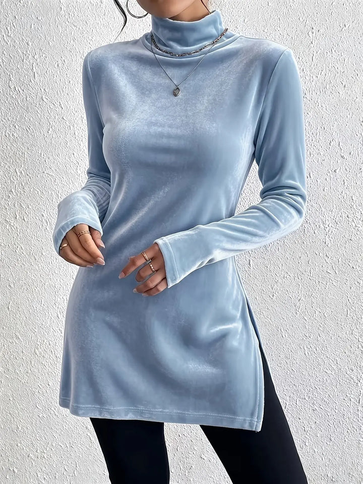 Woman wearing blue velvet mock turtleneck long sleeve top