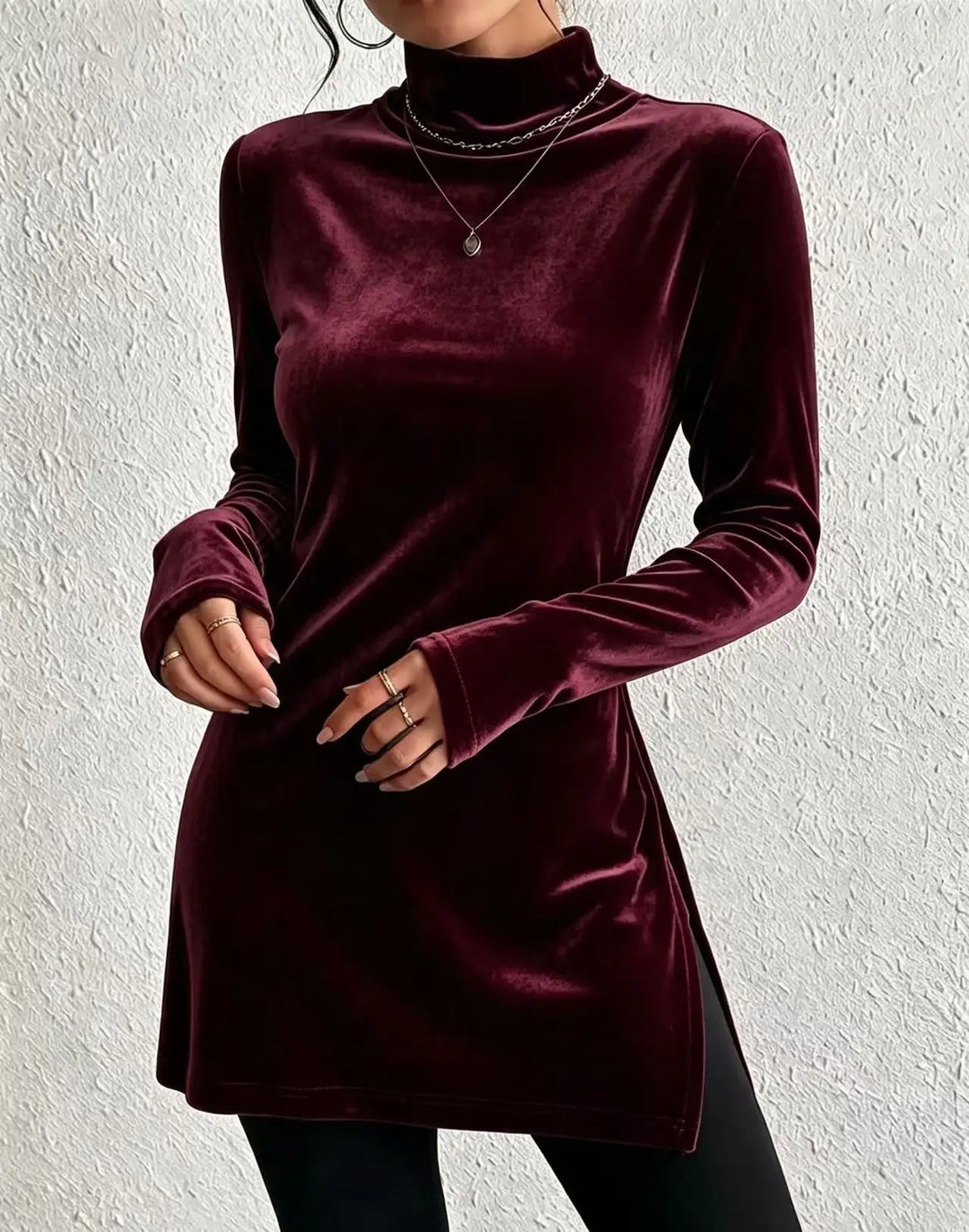 Woman wearing burgundy velvet mock turtleneck long sleeve top
