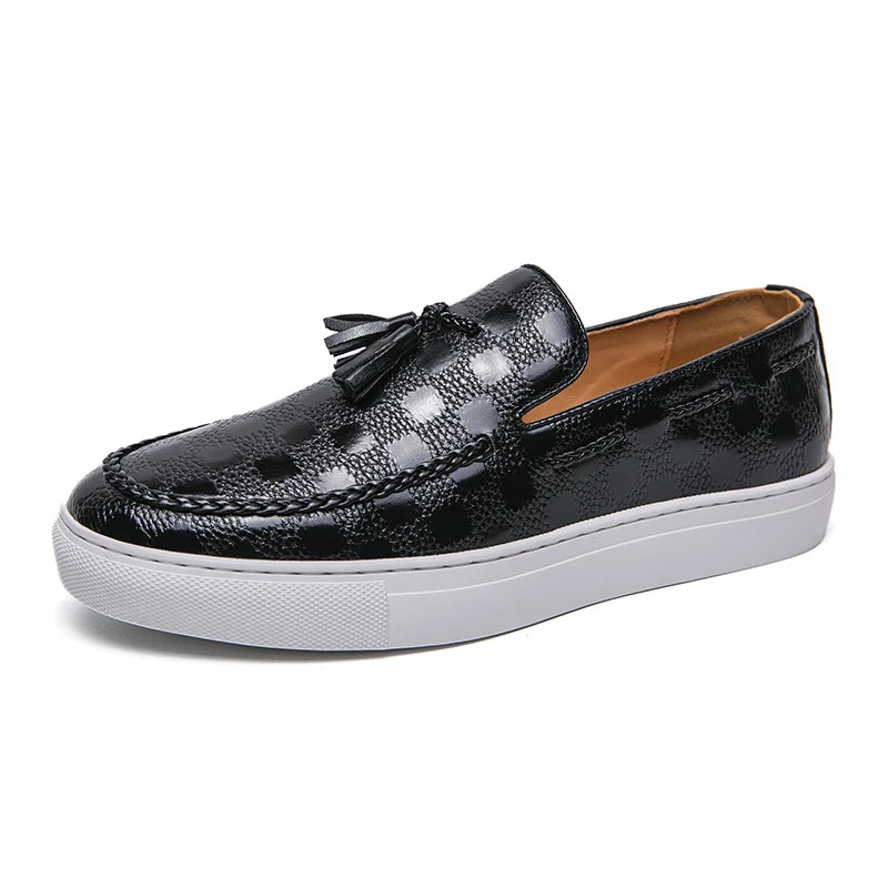Black tasseled loafer, angled front view