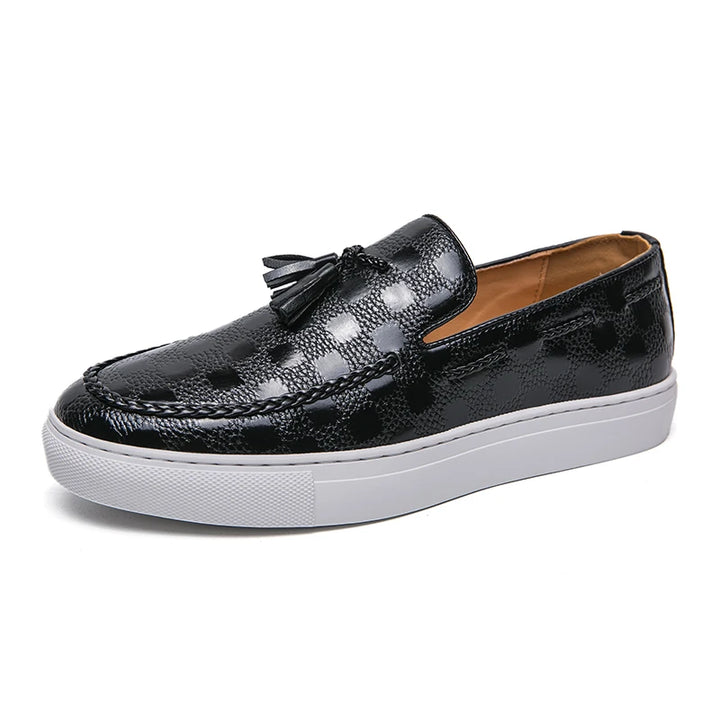 Black tasseled loafer, angled front view