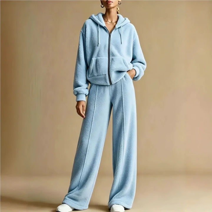 Woman wearing light blue sherpa hoodie and wide leg pants set