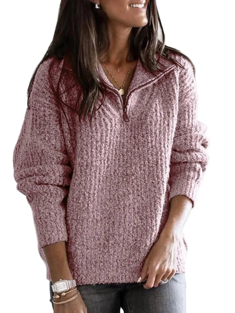 Woman wearing pink textured knit quarter-zip sweater with stand collar