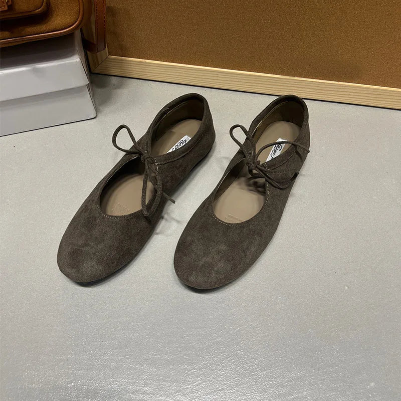 Grayish green suede-look ballet flats with butterfly-knot ties