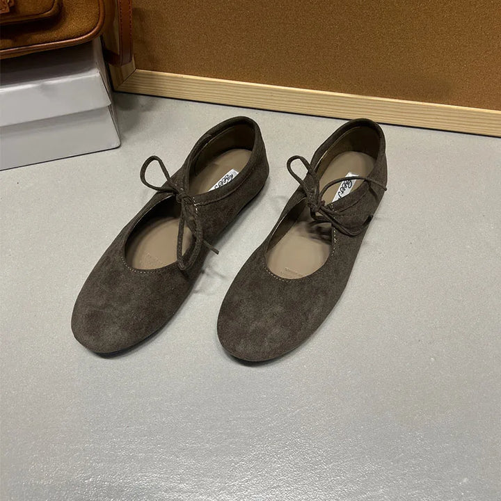 Grayish green suede-look ballet flats with butterfly-knot ties