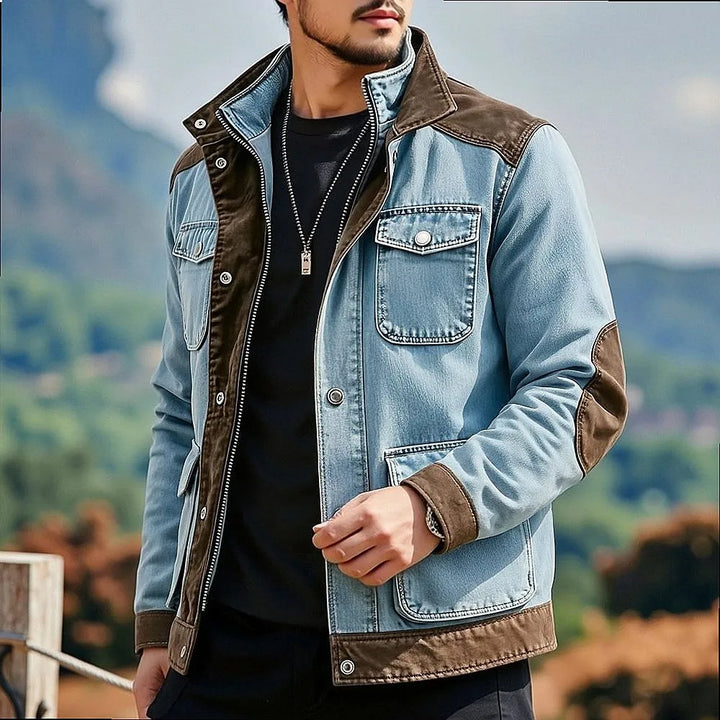 Man wearing blue denim contrast panel jacket, front view