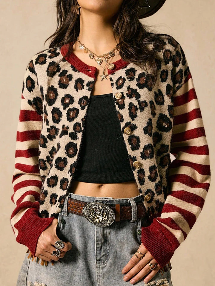 Woman wearing red striped leopard print cardigan sweater, close up front view