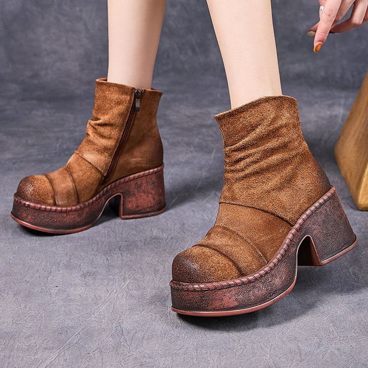 Model wearing brown platform ankle boots front view