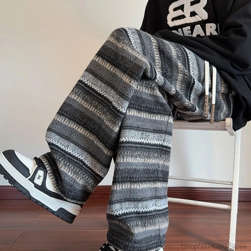 Close up of black striped wide leg pants seated showing texture