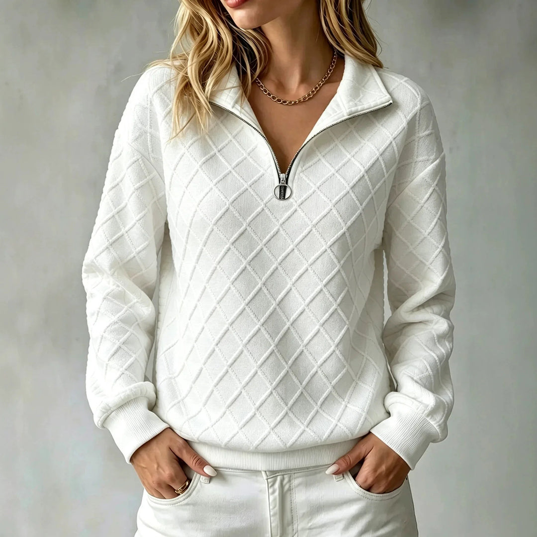 Woman wearing white diamond textured quarter zip pullover