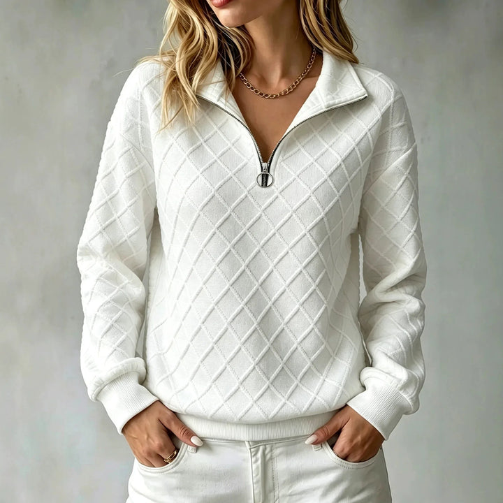 Woman wearing white diamond textured quarter zip pullover