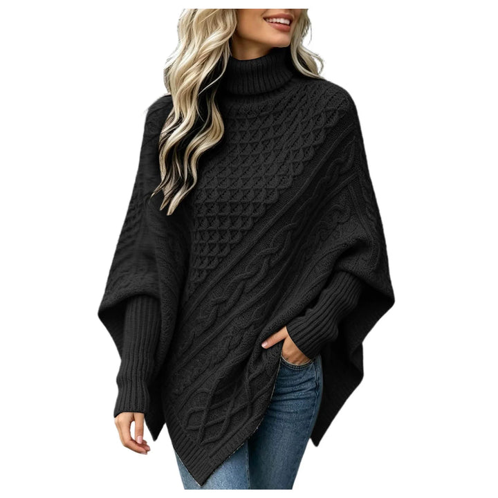 Woman wearing black cable knit asymmetric poncho sweater with turtleneck