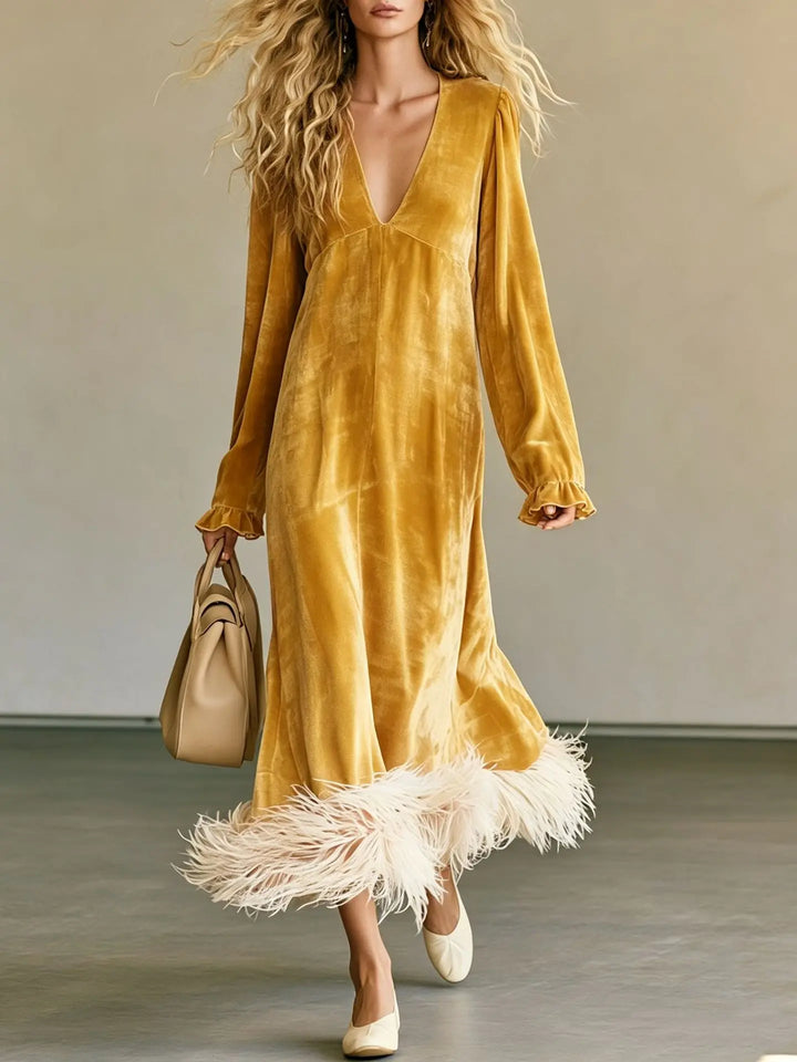 Yellow velvet maxi dress with feather trim hem, front view