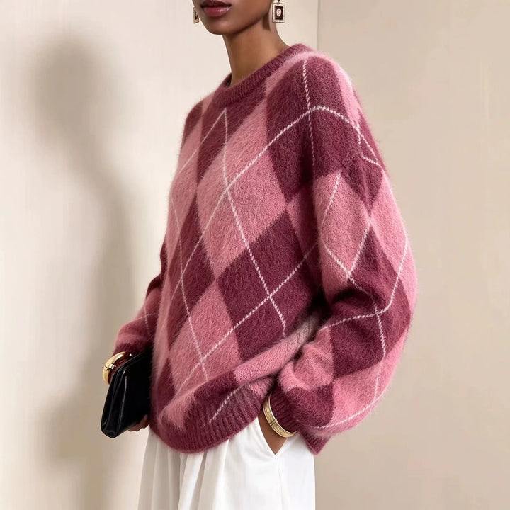 Side view of pink and burgundy argyle knit sweater