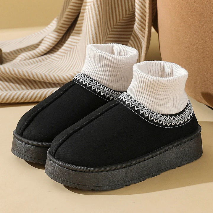 Black plush ankle boot with ribbed knit collar, side view