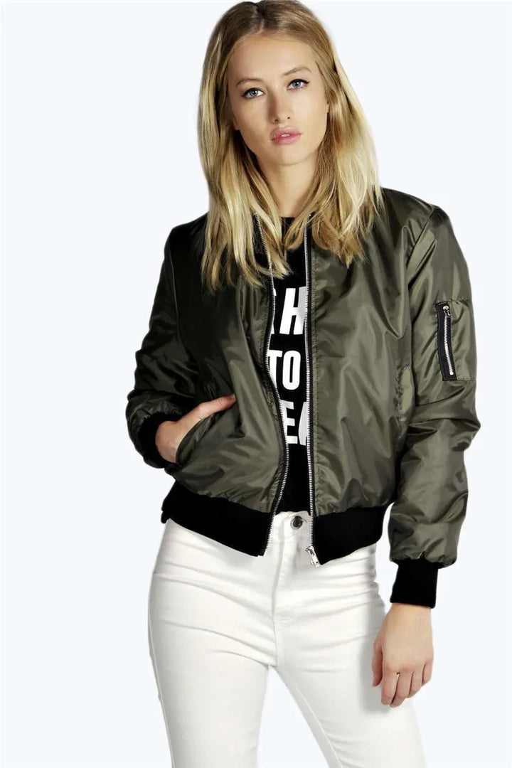 Woman wearing green bomber jacket, front view