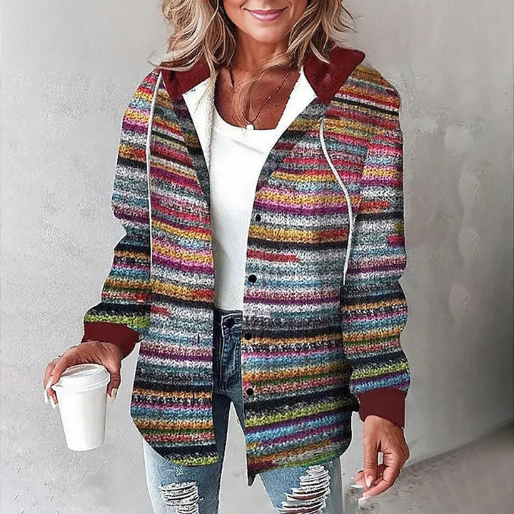 Woman wearing multicolored striped shacket with burgundy hood