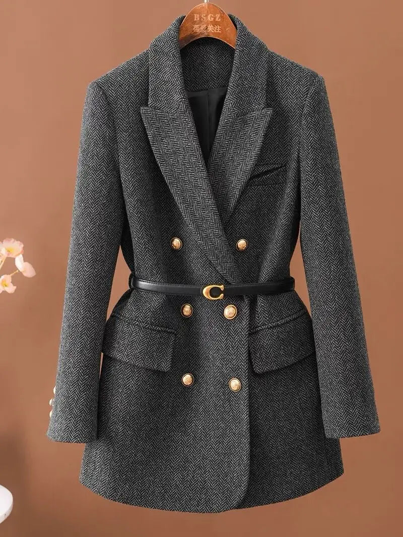 Dark gray herringbone belted blazer on hanger, front view
