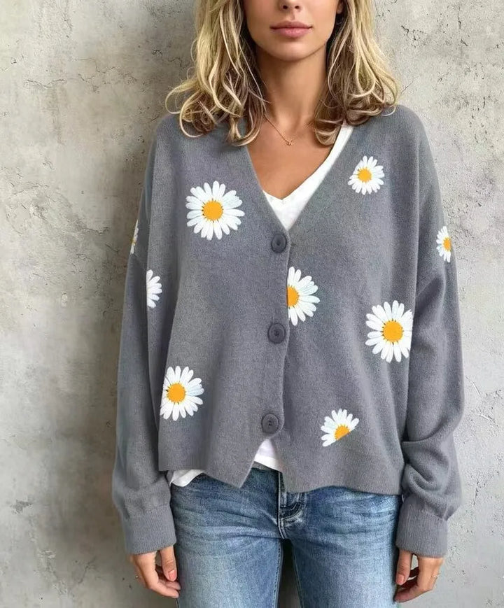 Woman wearing gray daisy embroidered cardigan