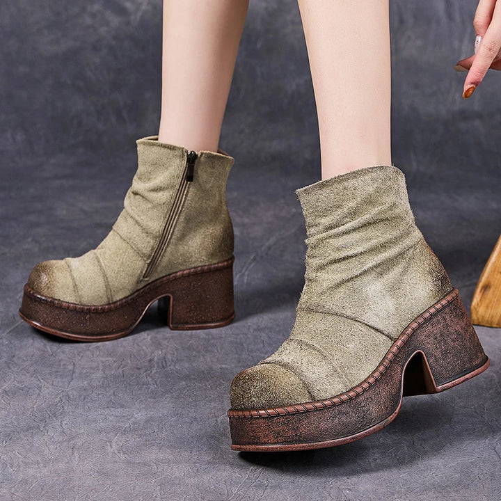Model wearing beige platform ankle boots side view