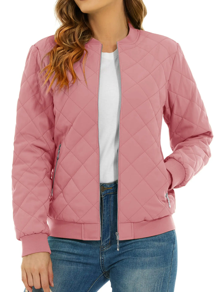 Close up of pink quilted bomber jacket with zip pocket