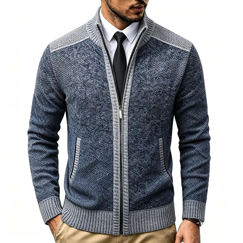 Man wearing dark grey zip-up knit cardigan with light grey trim, front view