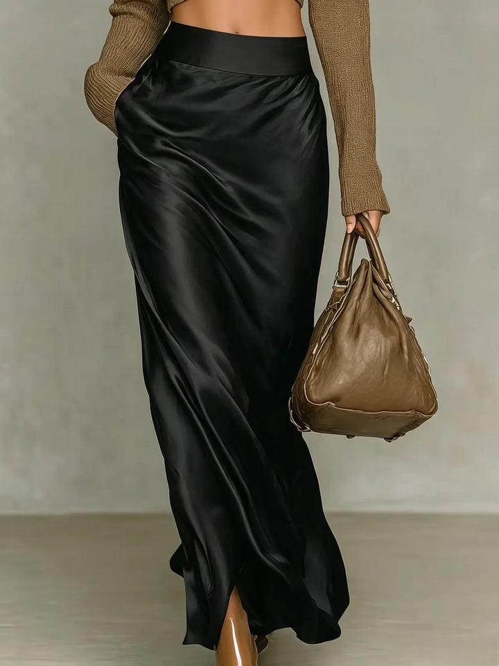Black satin maxi skirt with side slit, back view